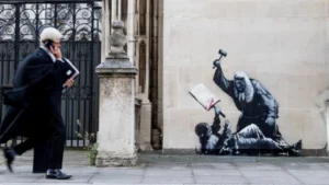 Banksy mural of a judge beating a protester to be removed
